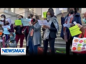 Read more about the article WATCH: Pro-mask protestors break out in song about mandates | National Report