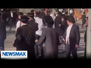 Read more about the article Orthodox Jewish men protesting Israel military draft | REPORT | Wake Up America