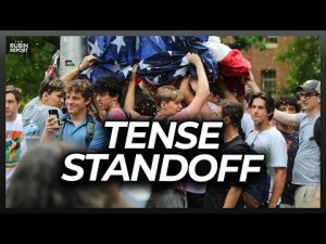 Read more about the article Watch Tense Standoff as Frat Guys Are Pelted While Holding Up the U.S. Flag