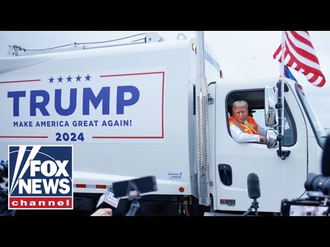 Read more about the article Trump stuns in sanitation outfit while giving presser from garbage truck