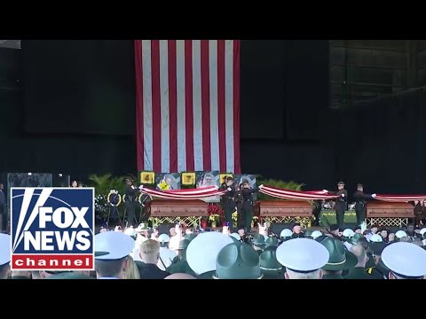 You are currently viewing President-elect Donald Trump pays his respect to fallen deputies