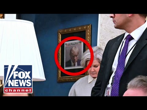 Read more about the article Trump hangs iconic mugshot outside the Oval Office